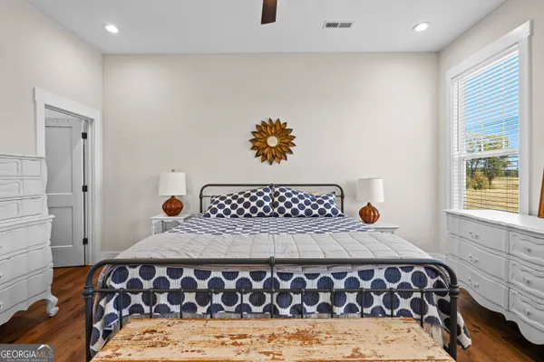 a bedroom with a bed and a couch