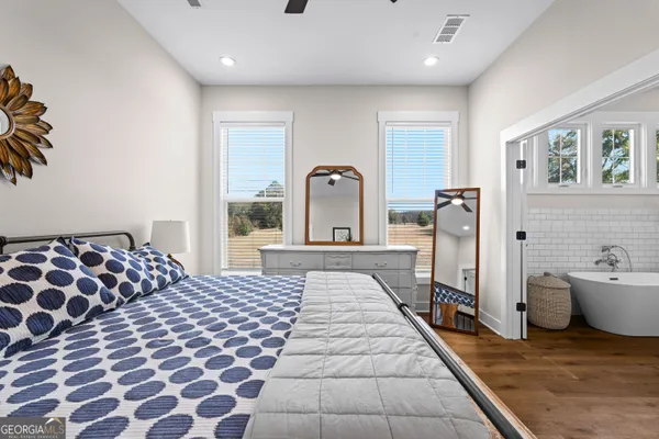 a view of room with closet and mirror