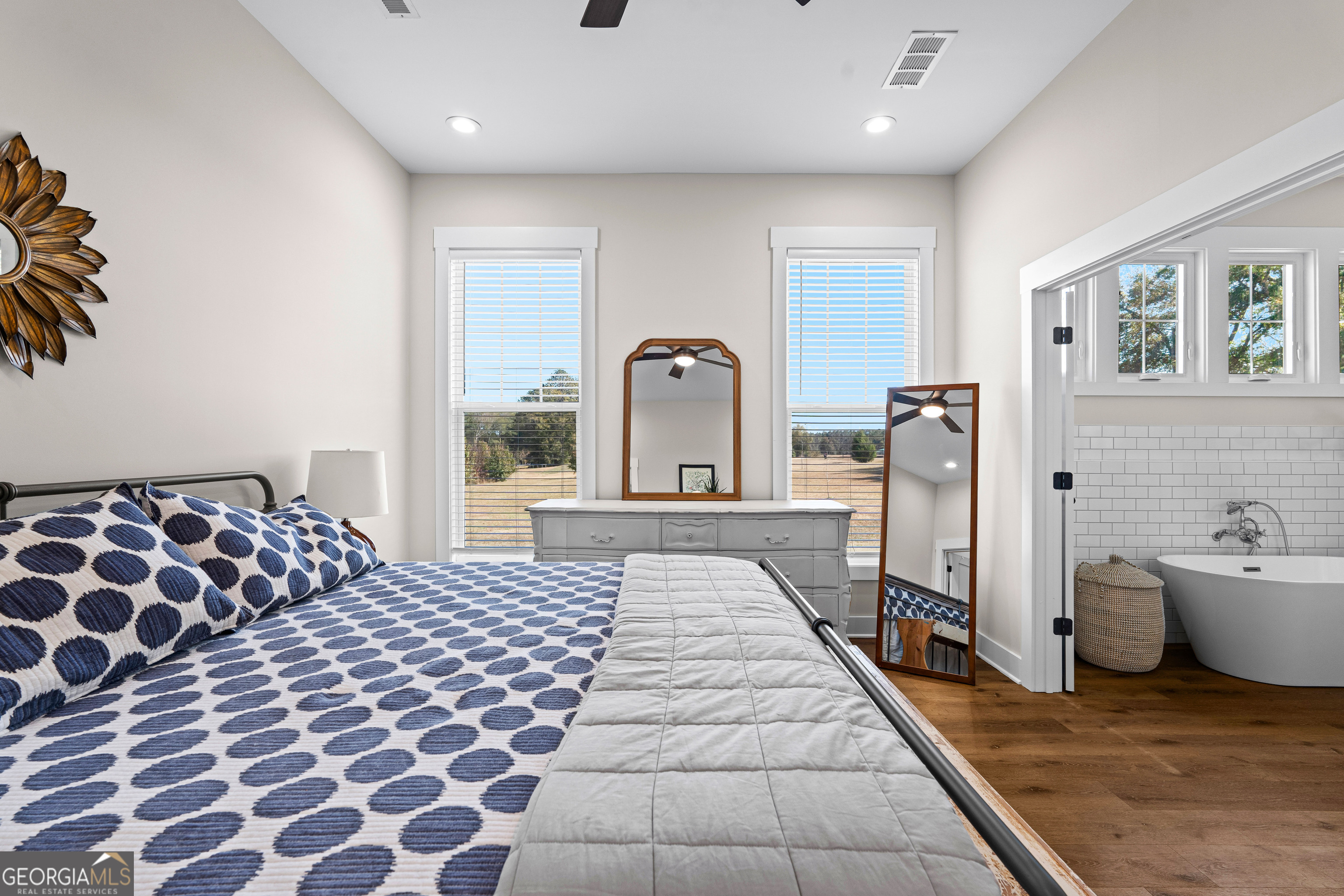 197 Dunn Road Molena, GA 30258 - Photo 32 of 76 a bedroom with a bed and a view of living room