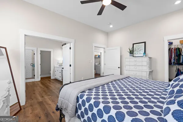 a view of walk in closet with clothes