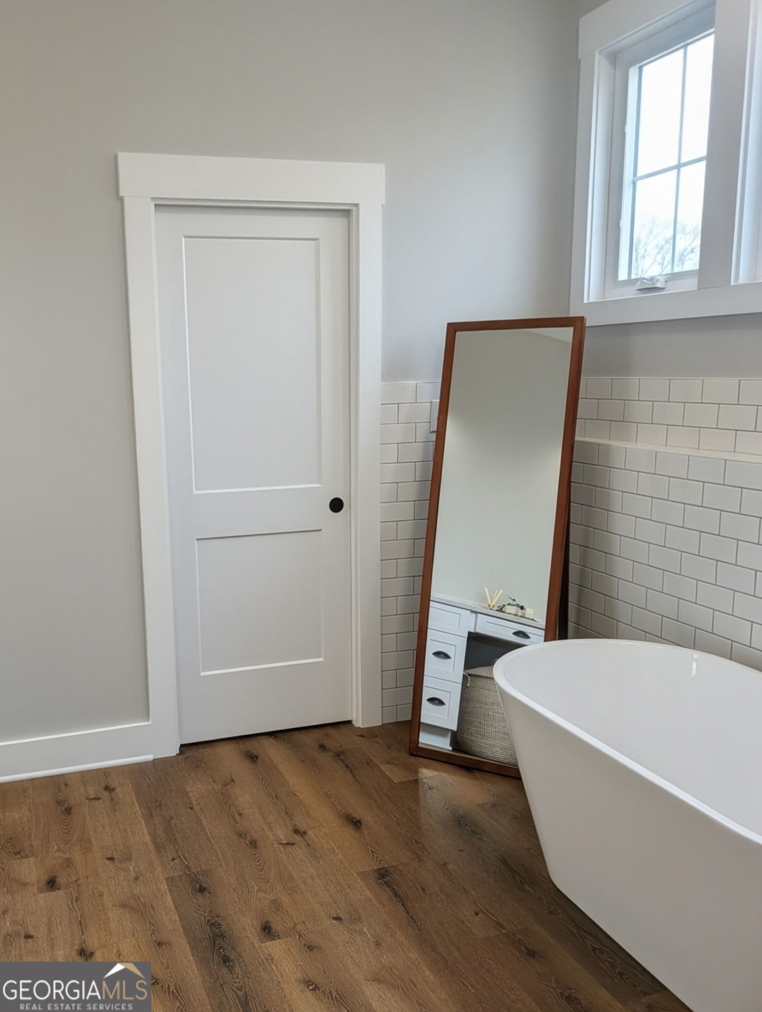 197 Dunn Road Molena, GA 30258 - Photo 36 of 76 a bathroom with a tub and a window