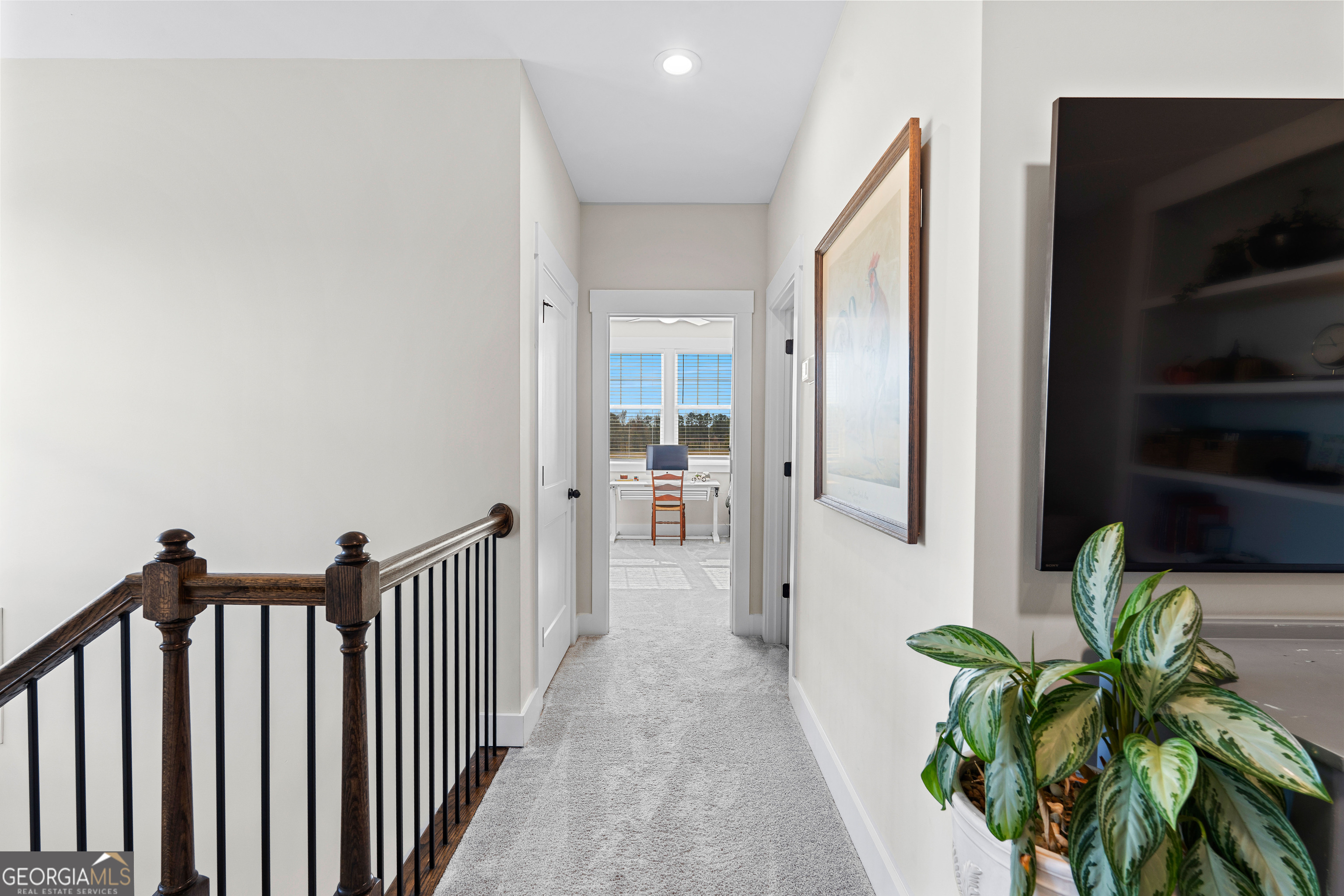 197 Dunn Road Molena, GA 30258 - Photo 40 of 76 a view of a hallway with wooden floor and a bathroom