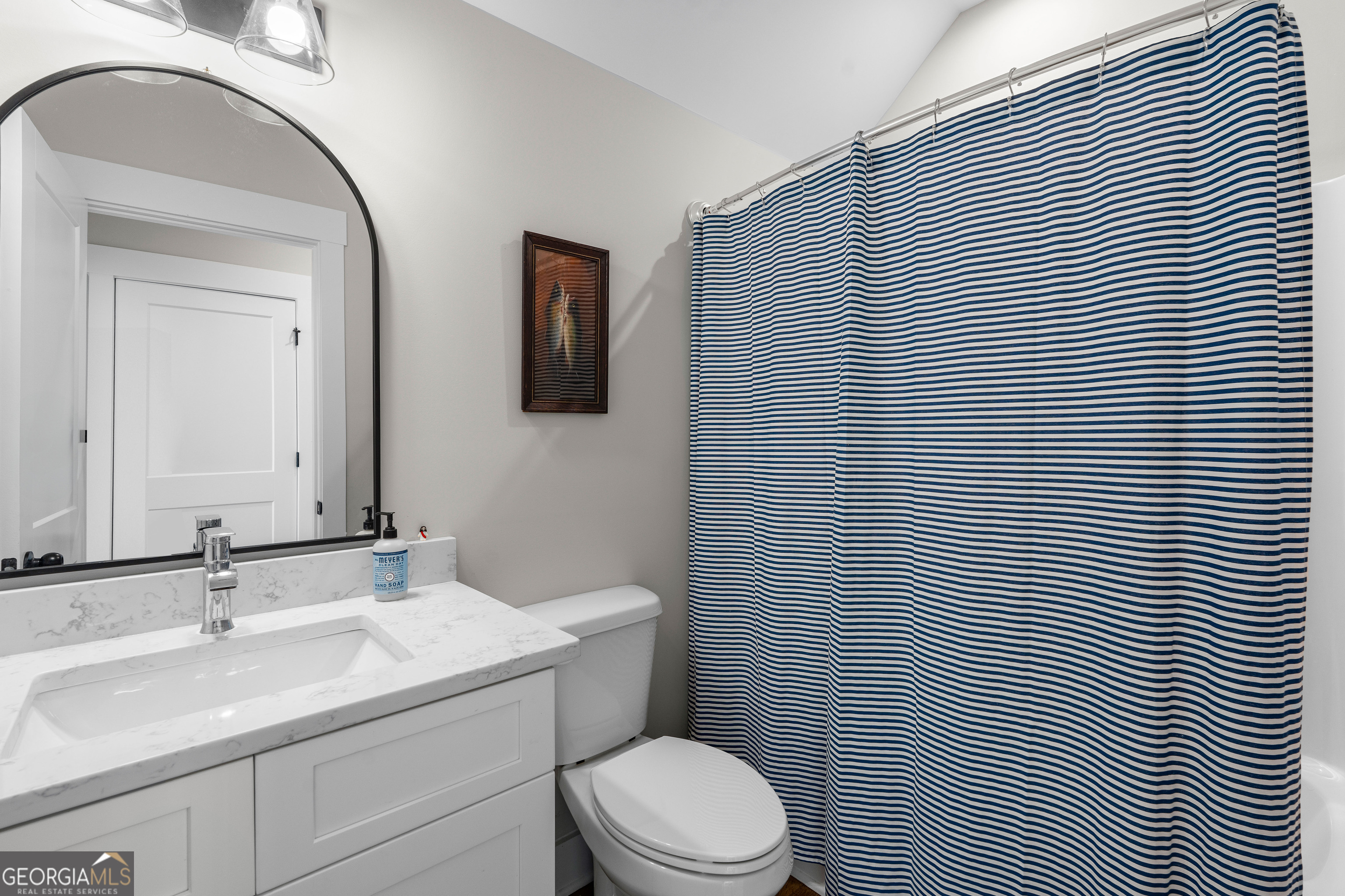 197 Dunn Road Molena, GA 30258 - Photo 45 of 76 a bathroom with a toilet a sink and mirror
