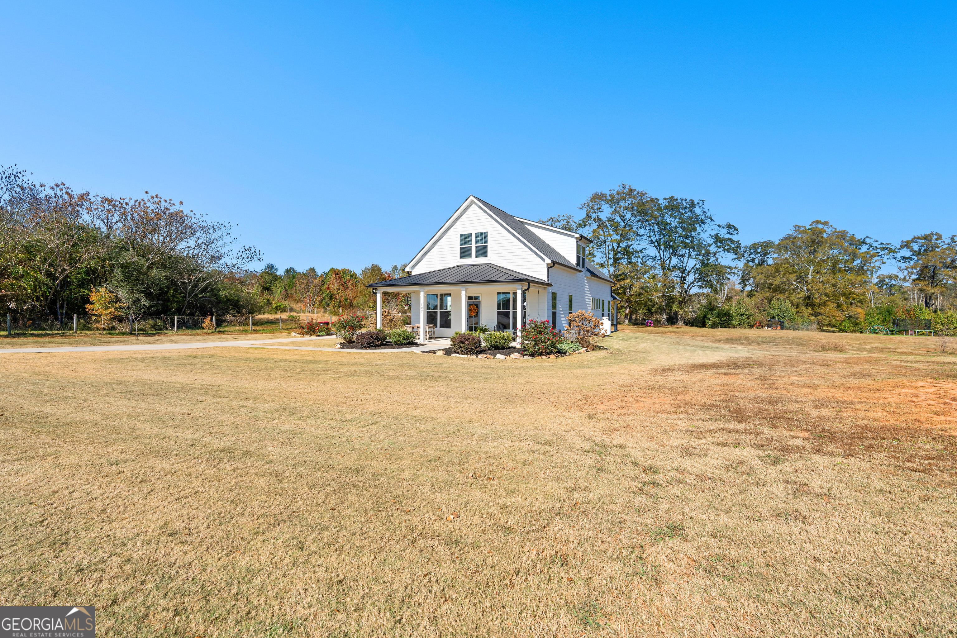 197 Dunn Road Molena, GA 30258 - Photo 5 of 76 a front view of a house with a yard