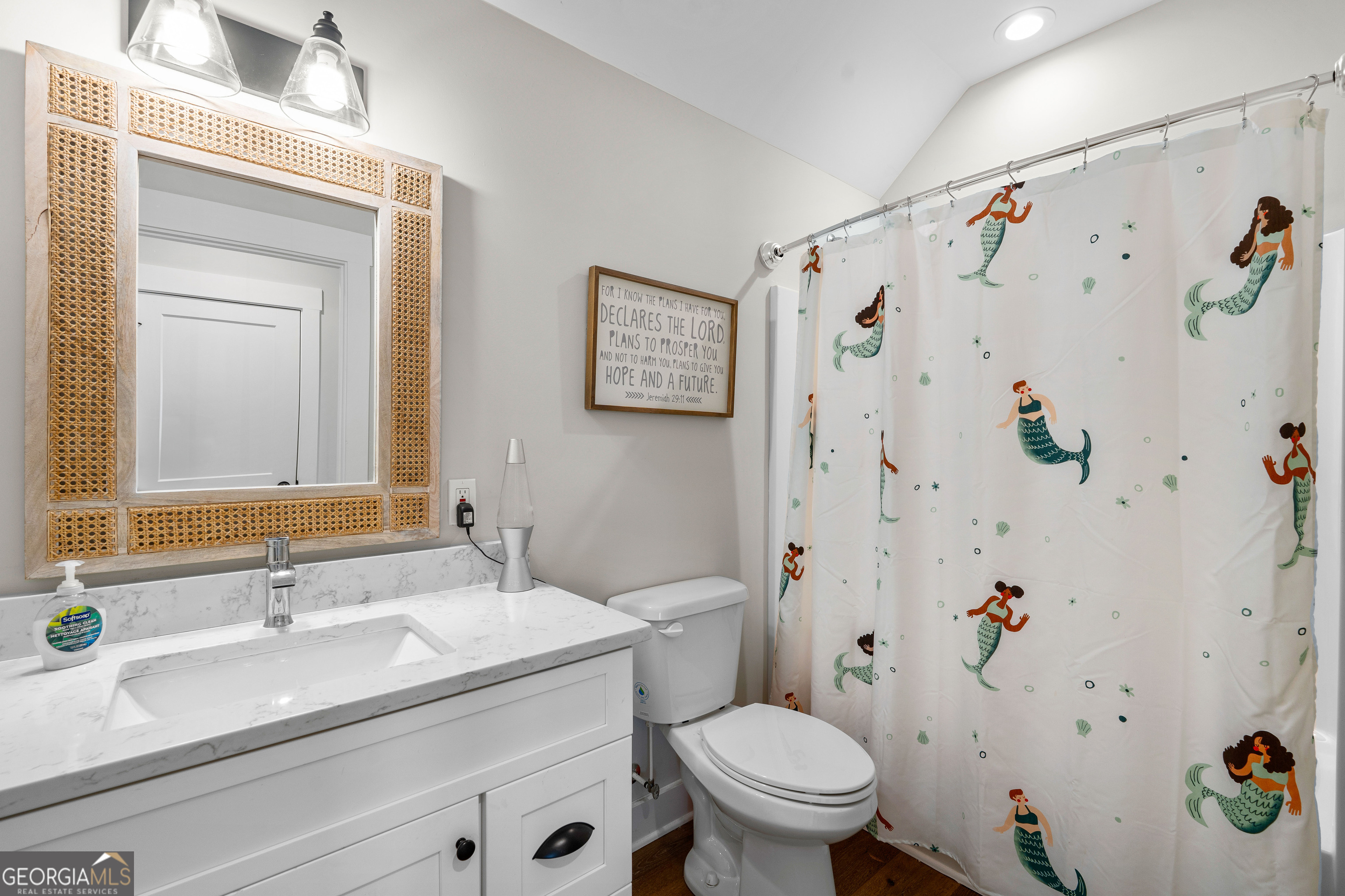 197 Dunn Road Molena, GA 30258 - Photo 52 of 76 a bathroom with a granite countertop sink a toilet and a shower curtain