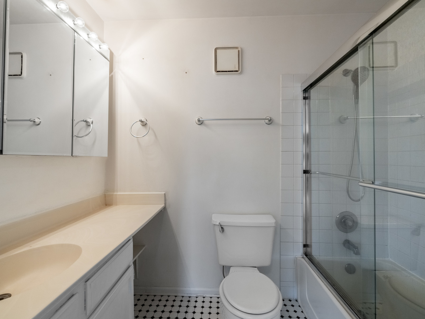 3265 Kirchoff Road, Unit 228 Rolling Meadows, IL 60008 - Photo 11 of 11 a bathroom with a sink toilet and shower