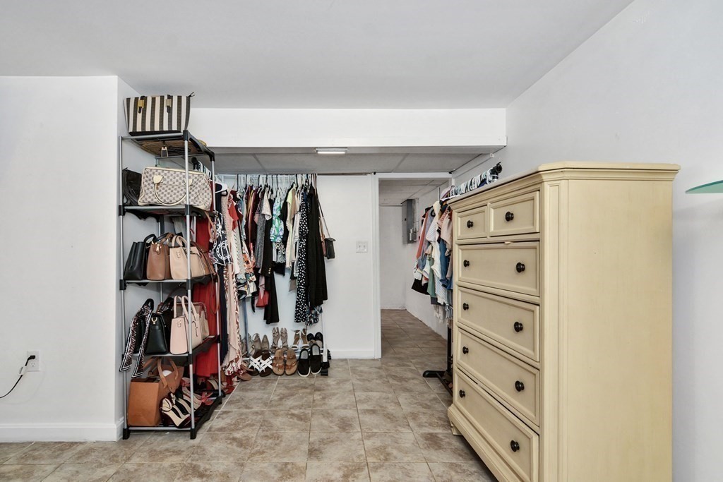39 Oregon Street Springfield, MA 01118 - Photo 33 of 40 a view of walk in closet with clothes