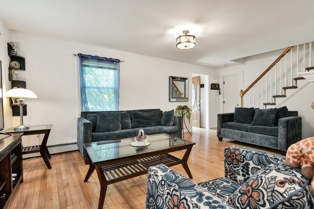 39 Oregon Street Springfield, MA 01118 - Photo 10 of 40 a living room with furniture and a table