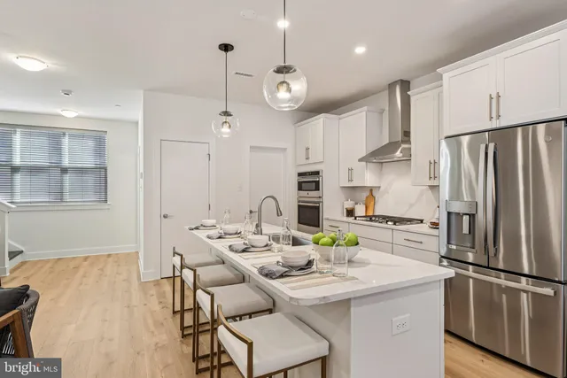 a kitchen with sink cabinets and refrigerator