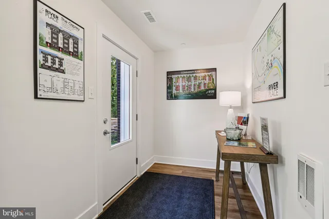 a bedroom with furniture and wooden floor