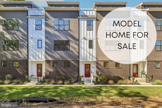 a view of a pathway of house with a yard