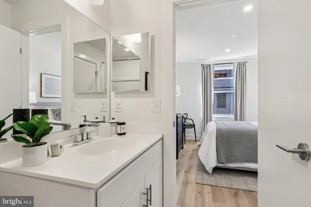 a bedroom with a bed and a desk