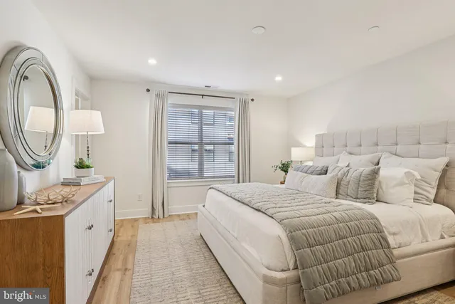 a bedroom with a bed and a dresser