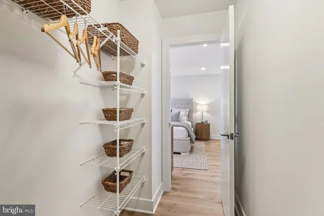 a bathroom with a tub shower sink and mirror