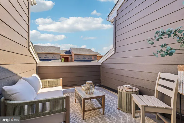 a front view of a building with a parking area