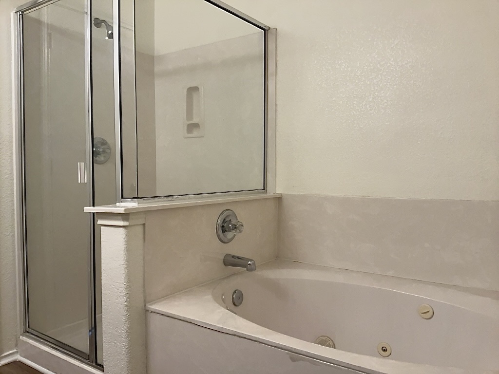 704 Big Sur Trail Taylor, TX 76574 - Photo 12 of 18 Full bath featuring a tub with jets and a shower stall