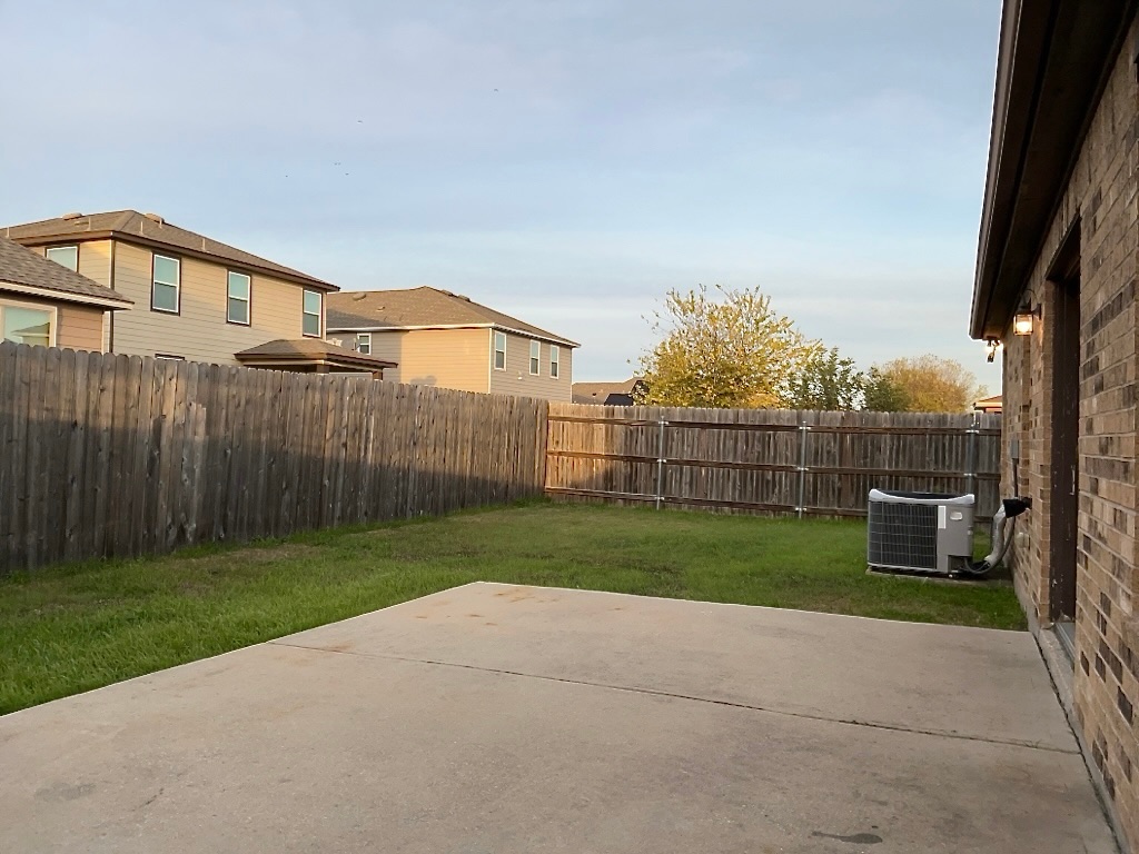 704 Big Sur Trail Taylor, TX 76574 - Photo 18 of 18 Fenced backyard featuring a patio area and a residential view