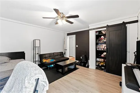 a bedroom with furniture and a window