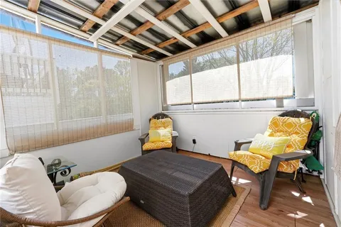 a bedroom with furniture and a window