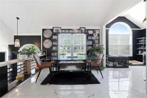 a living room with furniture a window and a fireplace