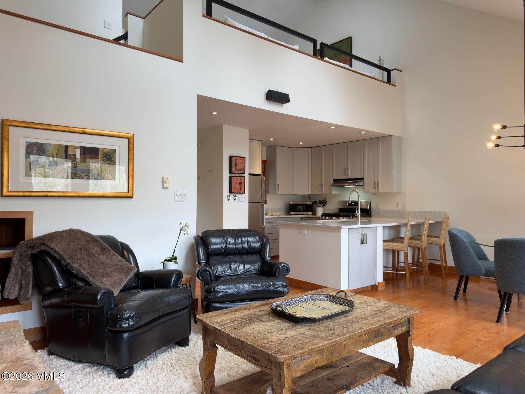 2875 Manns Ranch Road, Unit J2 Vail, CO 81657 - Photo 4 of 25 a living room with furniture and kitchen view