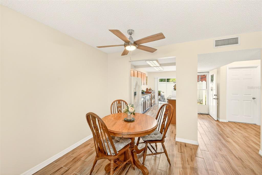 2064 Sunset Point Road, Unit 73 Clearwater, FL 33765 - Photo 15 of 58 a dining room with furniture and window