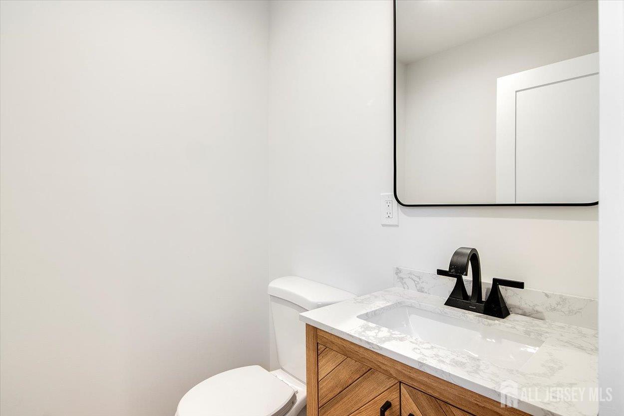 130 Ridge Road Colonia, NJ 07067 - Photo 12 of 28 a bathroom with a sink and mirror