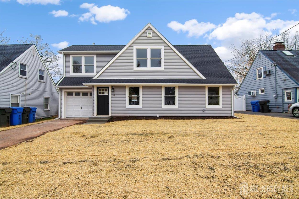 130 Ridge Road Colonia, NJ 07067 - Photo 2 of 28 a big house with wooden fence and trees