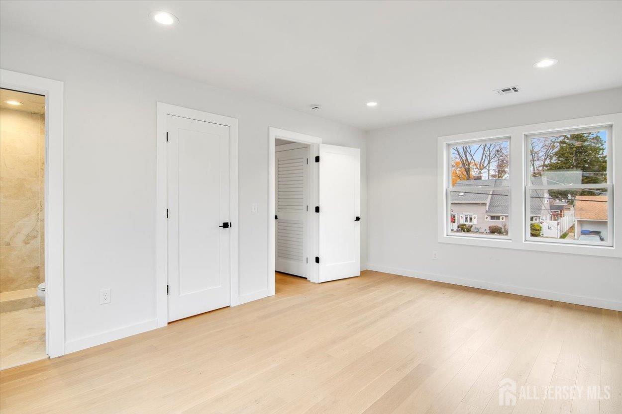 130 Ridge Road Colonia, NJ 07067 - Photo 23 of 28 a view of an empty room with a window
