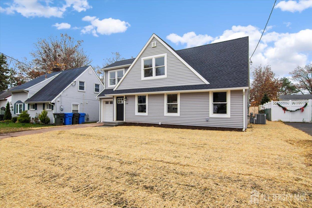 130 Ridge Road Colonia, NJ 07067 - Photo 3 of 28 a front view of a house with a yard