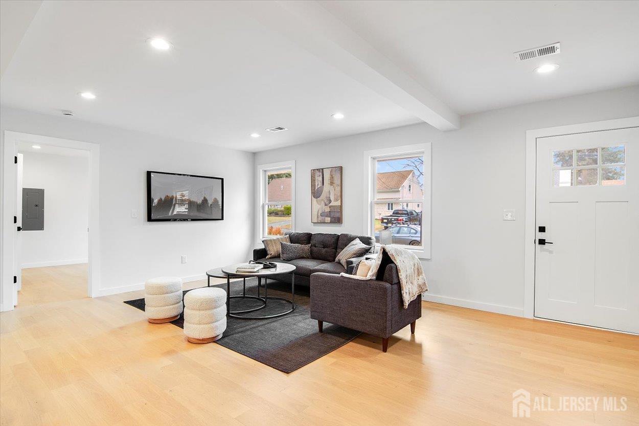 130 Ridge Road Colonia, NJ 07067 - Photo 4 of 28 a living room with furniture and a flat screen tv