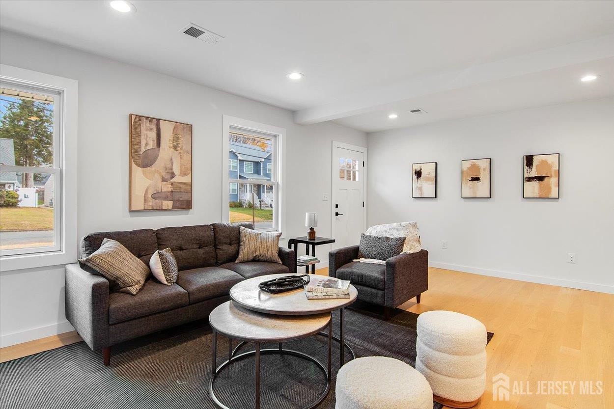 130 Ridge Road Colonia, NJ 07067 - Photo 7 of 28 a living room with furniture and a large window