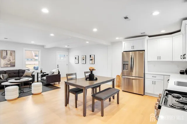 a kitchen with refrigerator cabinets and furniture