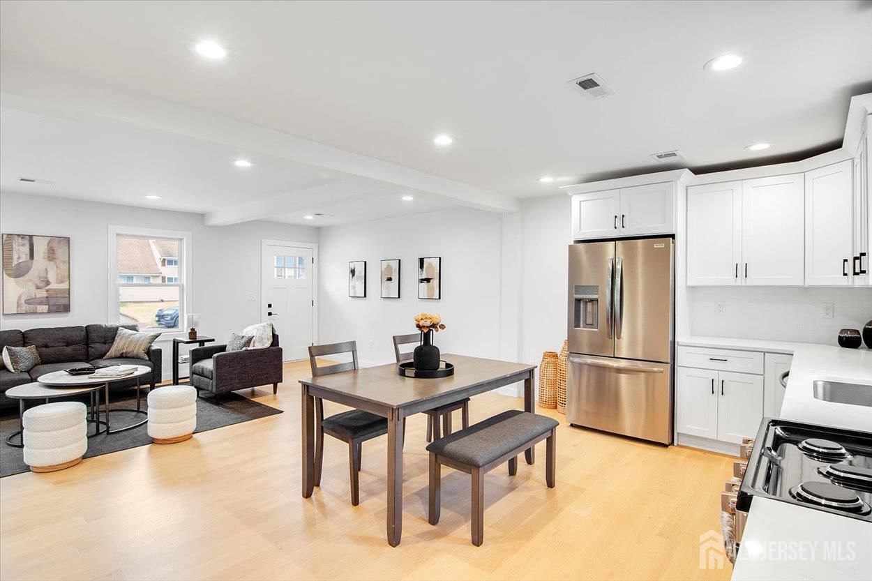 130 Ridge Road Colonia, NJ 07067 - Photo 10 of 28 a kitchen with refrigerator cabinets and furniture