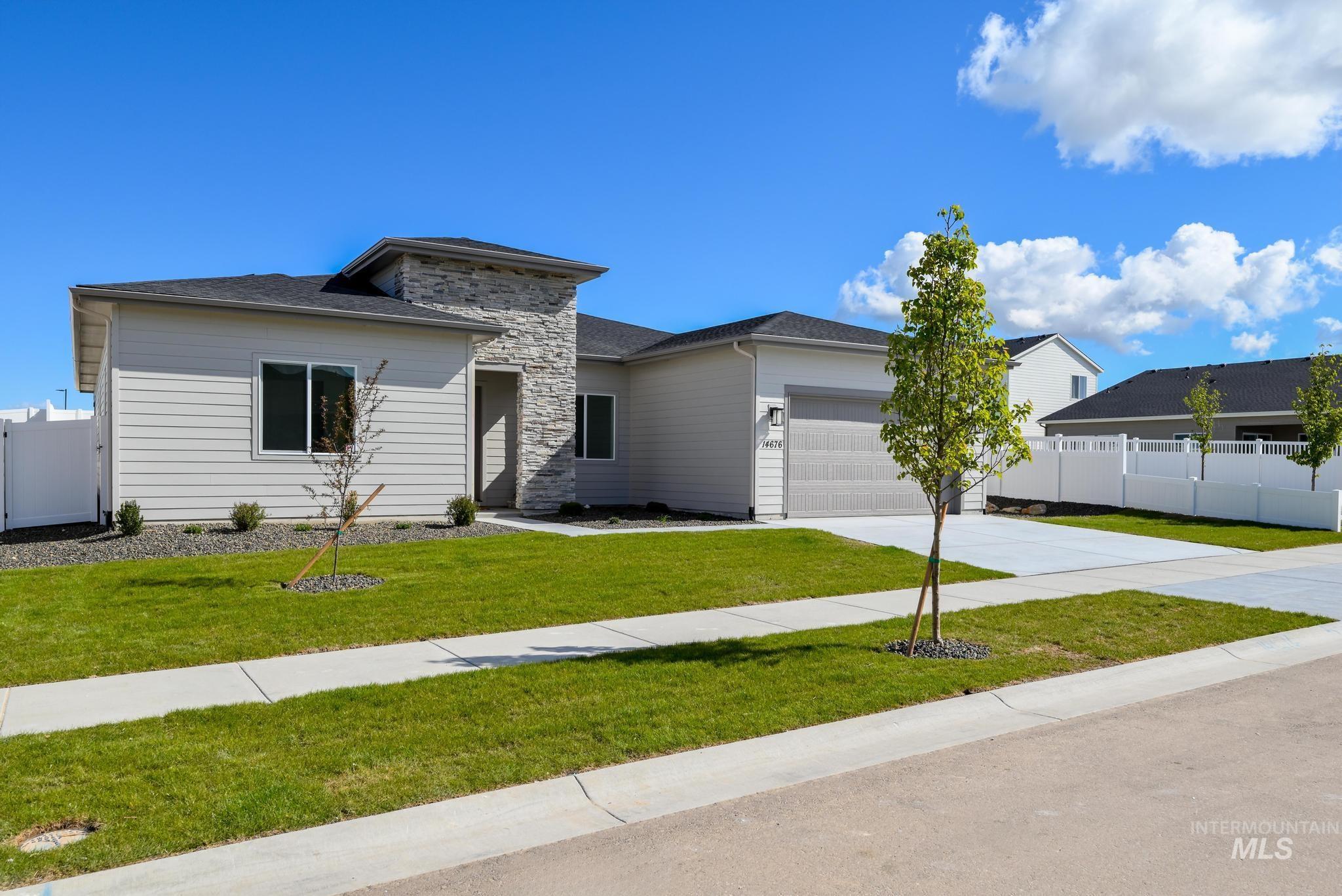 14676 Serenity Pt Street Caldwell, ID 83607 - Photo 2 of 41 Contemporary single-story residence featuring a stone accent façade and light-colored siding
