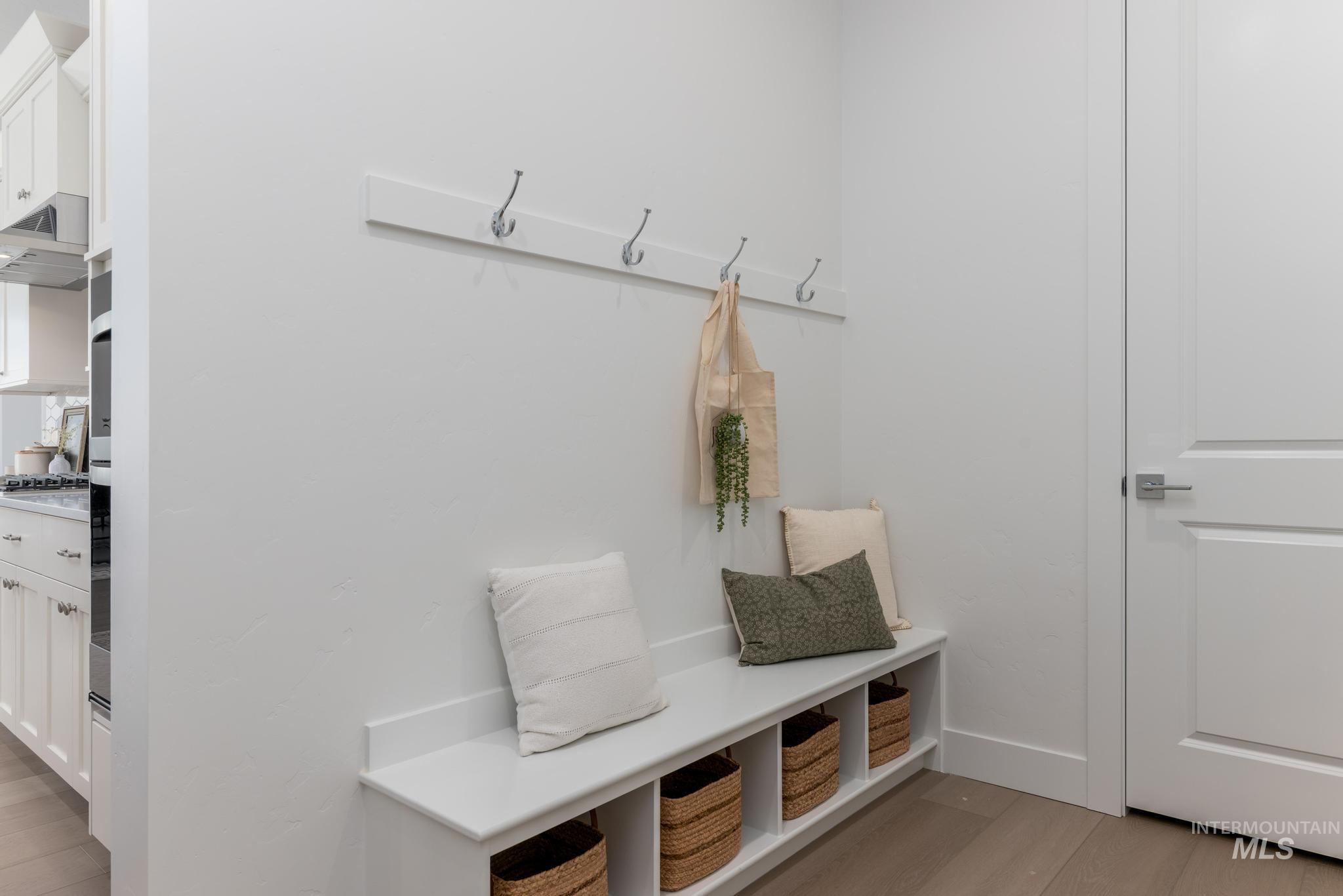 14676 Serenity Pt Street Caldwell, ID 83607 - Photo 28 of 41 Built-in bench with integrated storage cubbies, paired with wall-mounted coat hooks