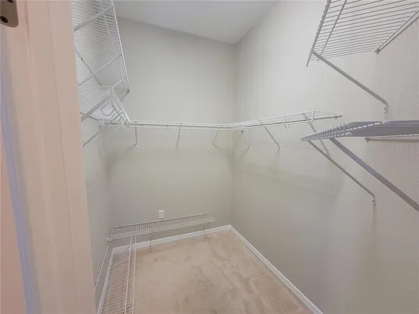 a view of a room with racks on the wall