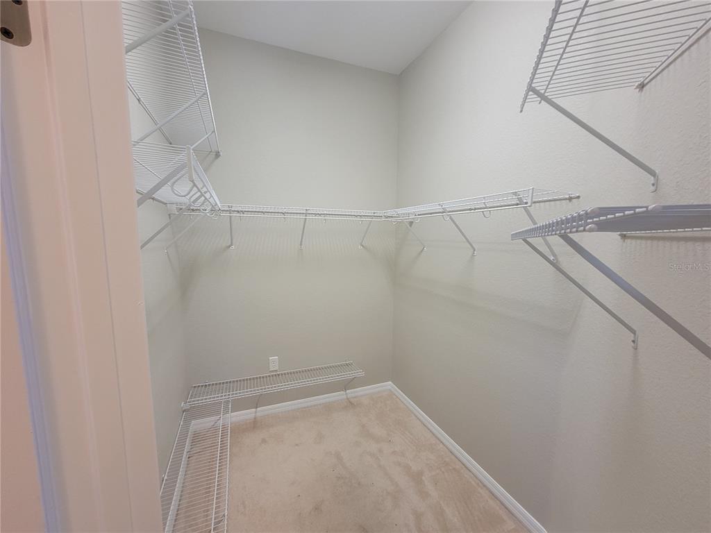 6243 Southwest 90th Street Ocala, FL 34476 - Photo 10 of 13 a view of a room with racks on the wall