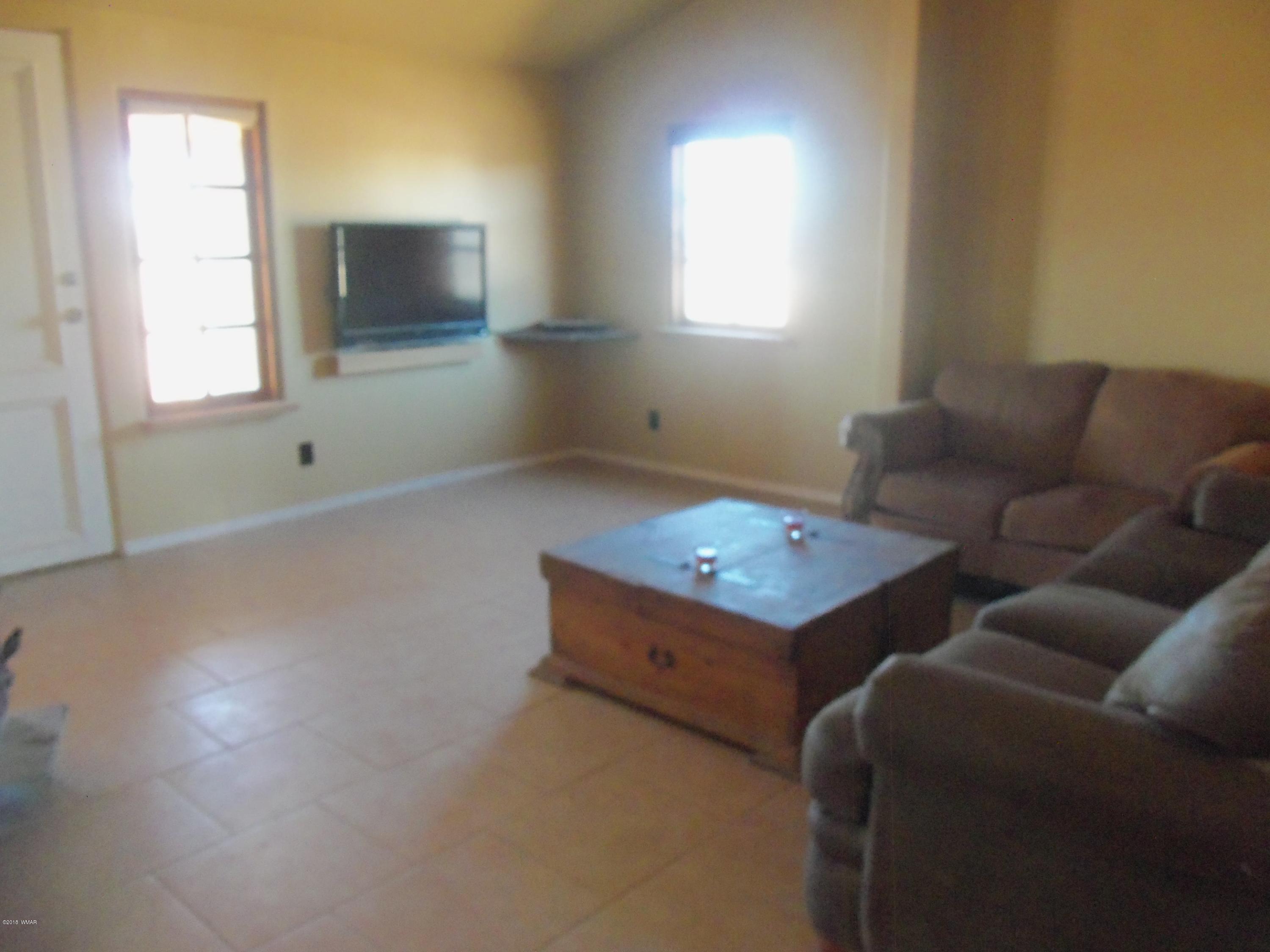 46 8307 Concho, AZ 85924 - Photo 16 of 34 a living room with furniture and a flat screen tv