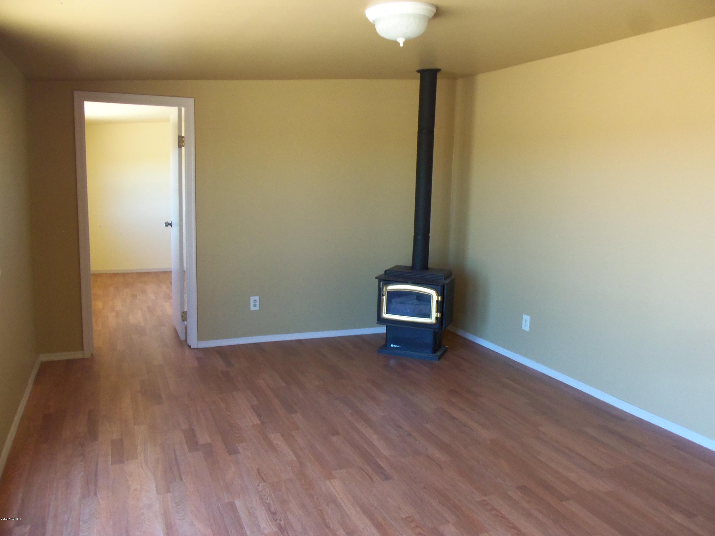 46 8307 Concho, AZ 85924 - Photo 24 of 34 a view of an empty room with wooden floor