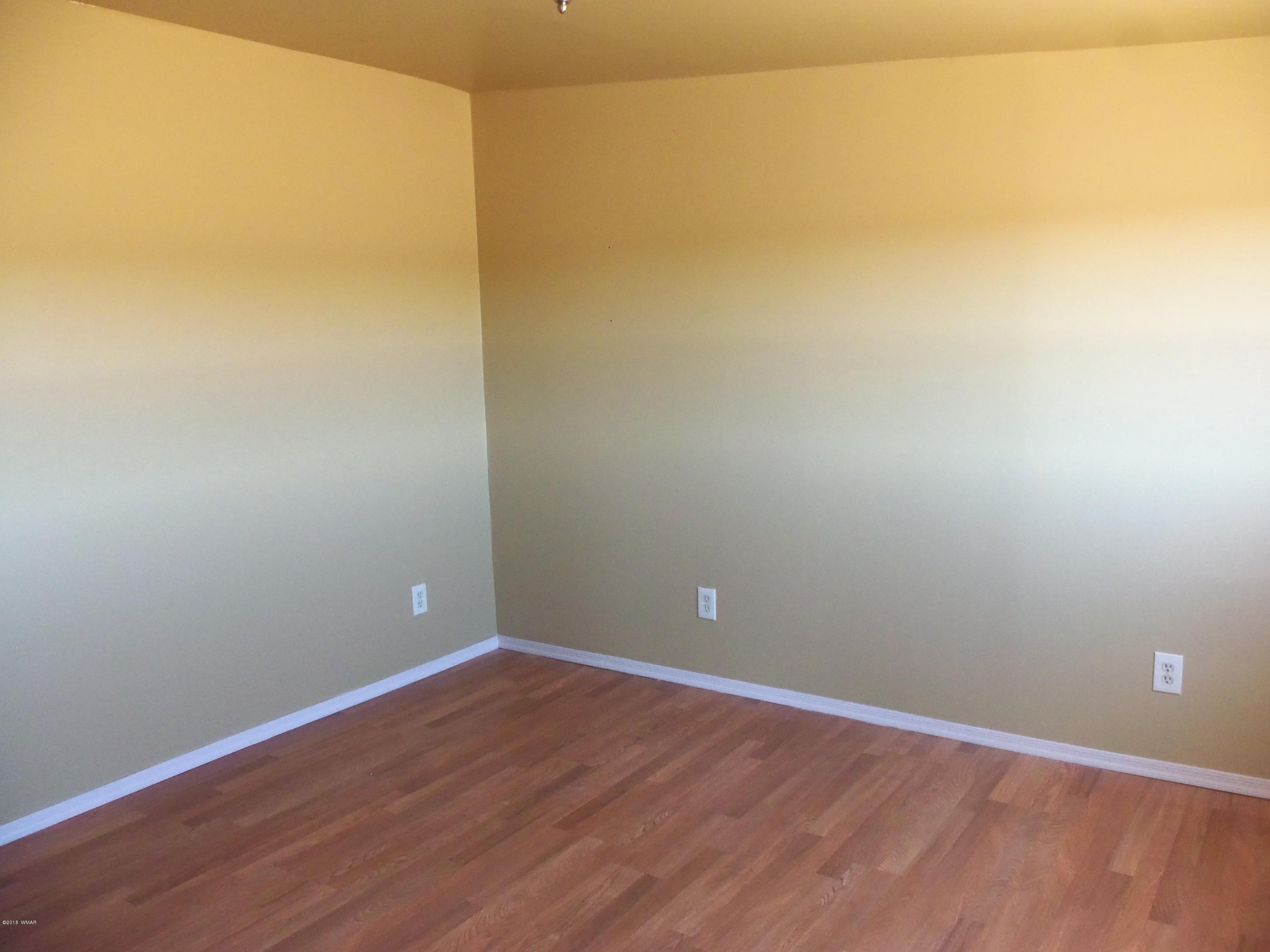 46 8307 Concho, AZ 85924 - Photo 26 of 34 wooden floor in an empty room