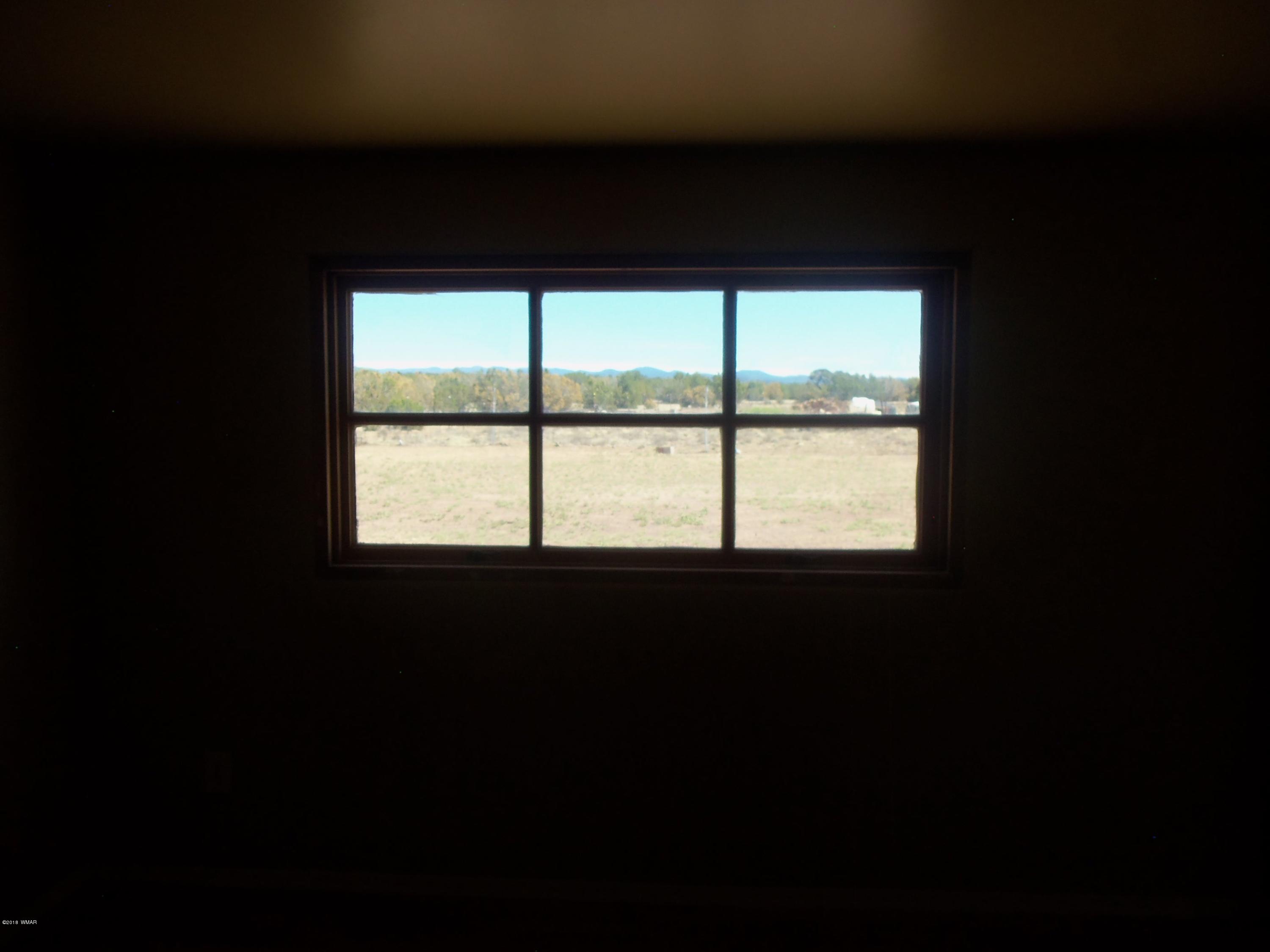 46 8307 Concho, AZ 85924 - Photo 27 of 34 a view of an empty room with a window