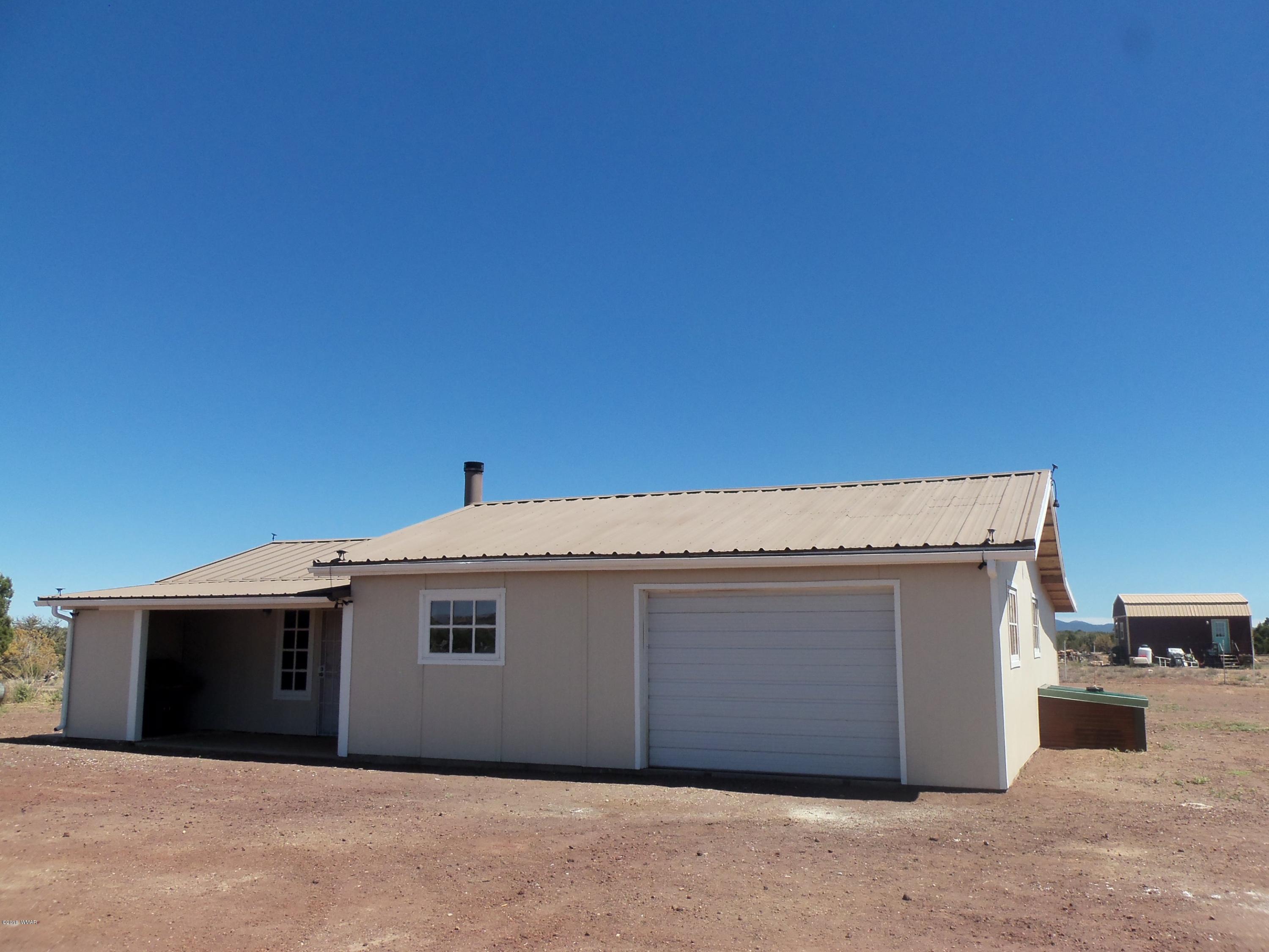 46 8307 Concho, AZ 85924 - Photo 3 of 34 a front view of a house with a garage