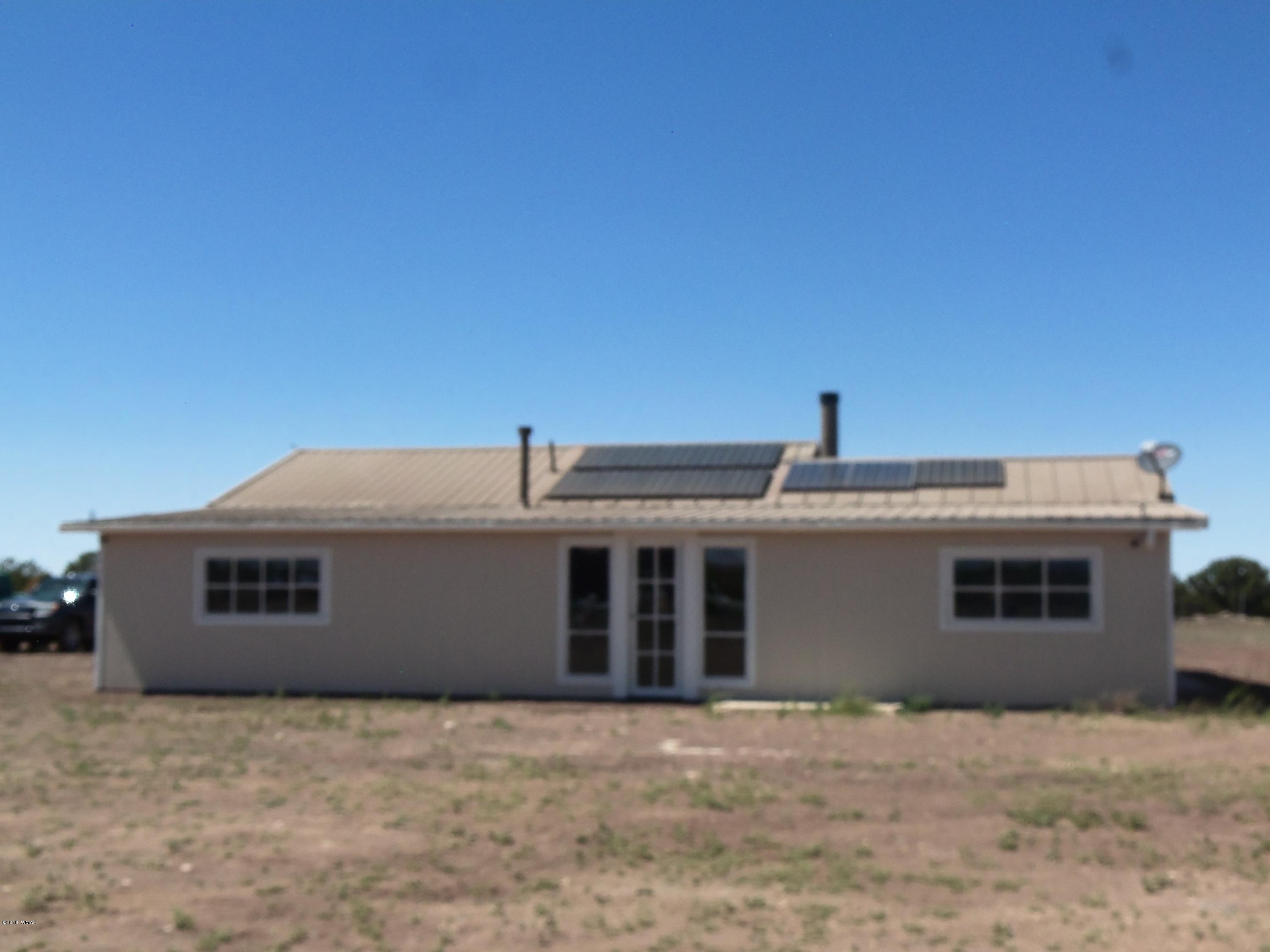 46 8307 Concho, AZ 85924 - Photo 8 of 34 a front view of a house with a balcony
