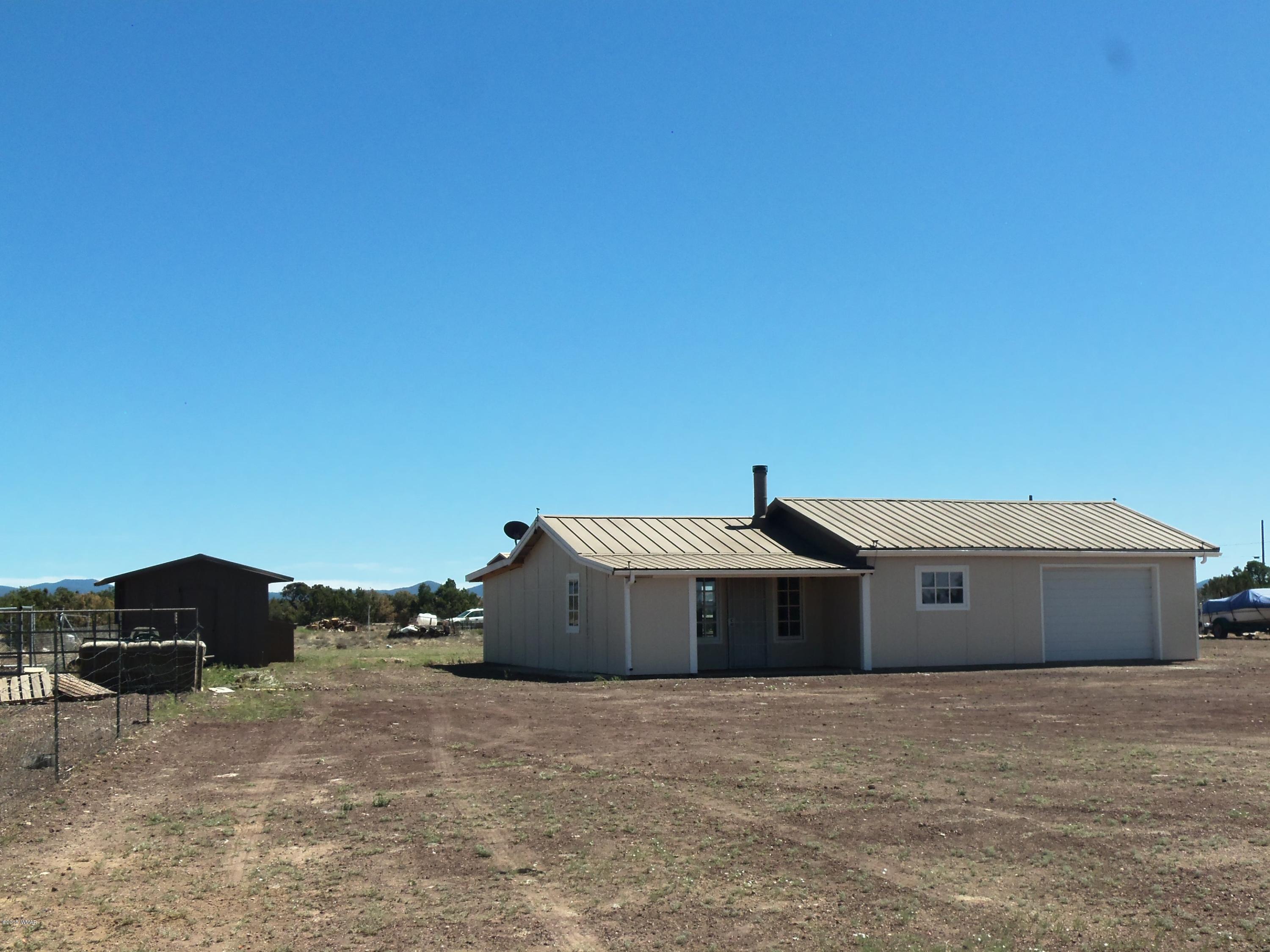 46 8307 Concho, AZ 85924 - Photo 10 of 34 a front view of a house with a yard