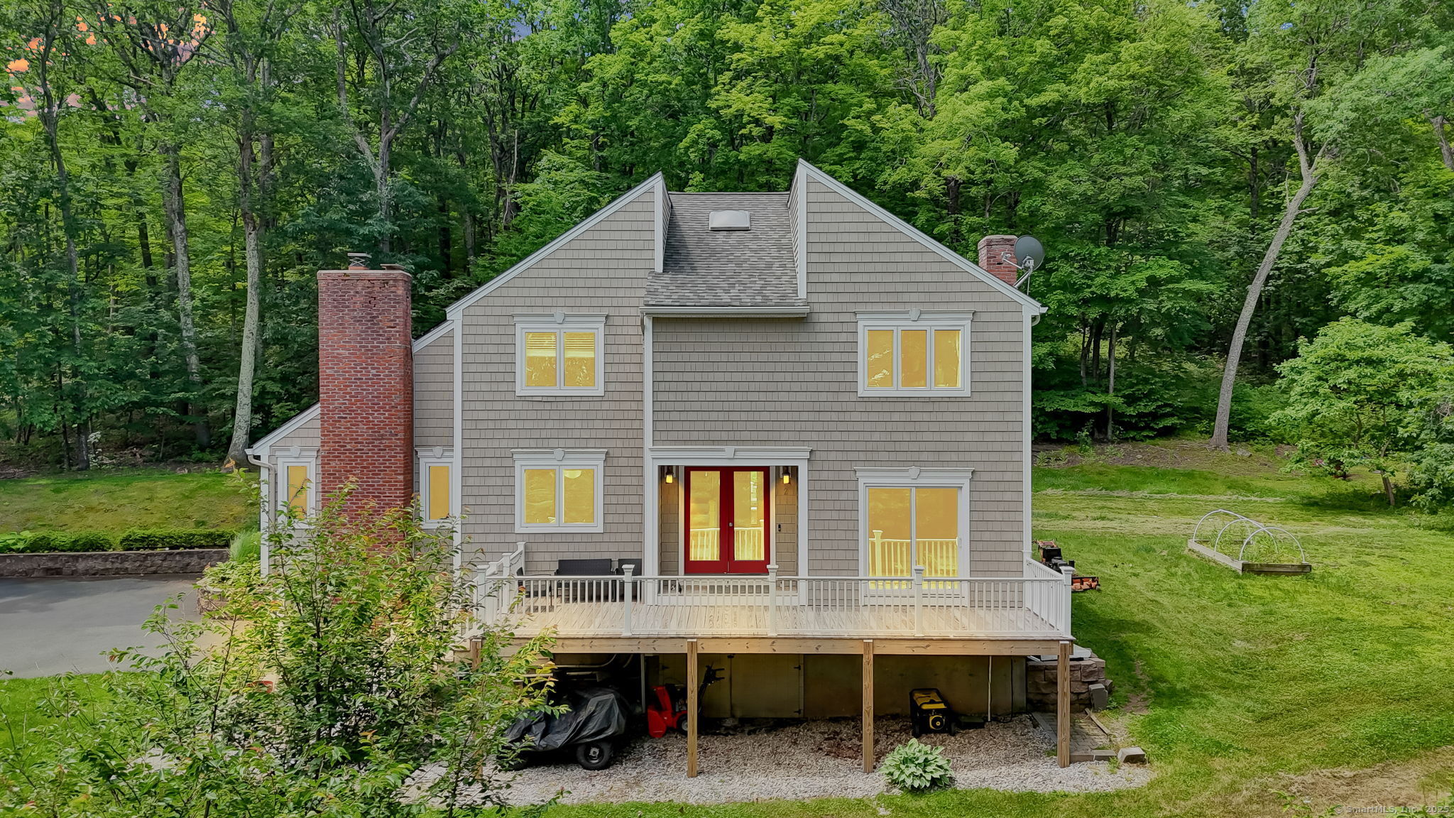a aerial view of a house with a yard