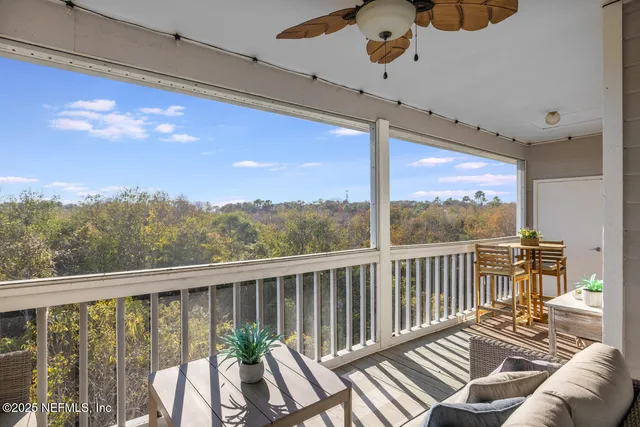 a view of balcony with furniture