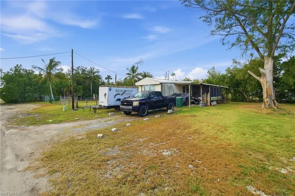 a view of a house with a big yard