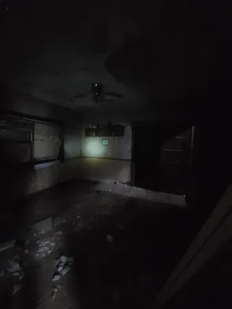 a bathroom with a toilet and a mirror