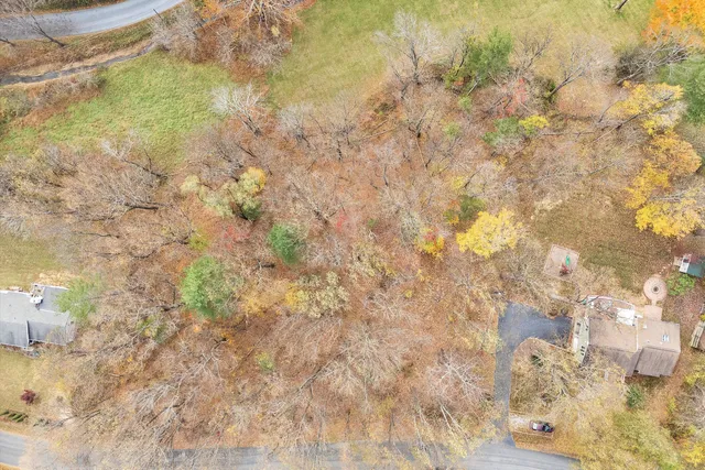 an aerial view of a house with pool outdoor seating and yard